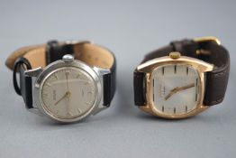 A collection of two wristwatches to include: A gold plated mechanical watch signed Dogma;