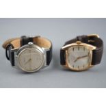 A collection of two wristwatches to include: A gold plated mechanical watch signed Dogma;