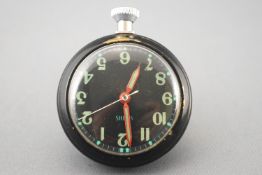 A black cased open face magnetic dashboard pocket watch by Smiths.