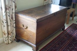 A George III mahogany chest with brass handles and bracket feet,