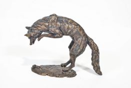 A bronze figure of a fox pouncing on a mouse, apparently un-signed,