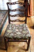 A pair of 18th century ladder back chairs with stuff over seats and square legs,