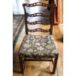 A pair of 18th century ladder back chairs with stuff over seats and square legs,