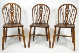 A set of eight mixed wood Provincial Windsor dining chairs with traditional bentwood backs