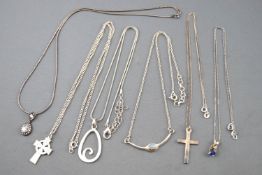 A collection of six white metal necklaces of variable designs.