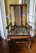 A George III mahogany elbow chair with pierced splat and drop in seat on cabriole legs