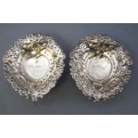 A pair of silver bonbon dishes, of heart shape design, with pierced and repousse decoration,