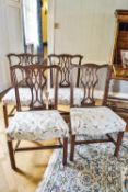 A set of four 18th century mahogany dining chairs with Chippendale style pierced inter-linked splats