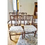 A set of four 18th century mahogany dining chairs with Chippendale style pierced inter-linked splats