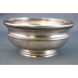 A small baluster form low silver bowl,