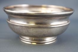 A small baluster form low silver bowl,