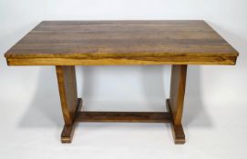 An African walnut dining table , 76cm high, 137cm wide,