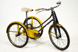 A "Silver" tricycle, in blue and yellow livery,