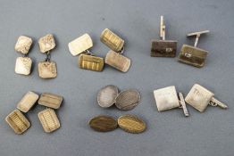 A collection of five pairs of cufflinks and two singles, of variable designs.
