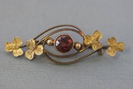 A yellow metal seed pearl horse shoe tie pin; tested as 9ct gold.