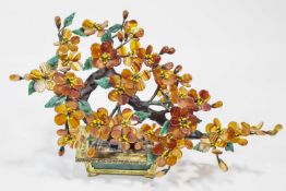 A Chinese banded orange and green agate model of a flowering Bonsai tree,