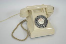 An ivory Bakelite 300 series working telephone