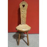 A Welsh oak chair with carved pierced back,