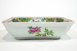 A Cantonese famille rose dish, of squared form, the interior decorated