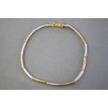 A yellow and white metal slim panel linked bracelet,