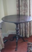 A mahogany George III style tripod table with bird cage on carved cabriole legs,