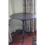 A mahogany George III style tripod table with bird cage on carved cabriole legs,