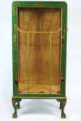 A green lacquer rounded rectangular display cabinet,