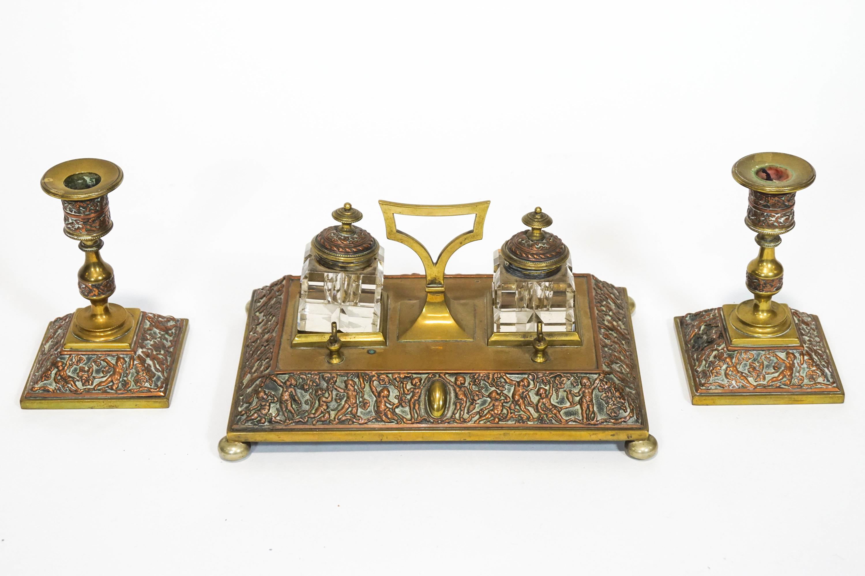 A Victorian brass desk set,