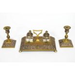 A Victorian brass desk set,