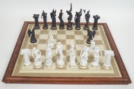 A Franklin Mint black and white porcelain 'The Chess set of the Gods'