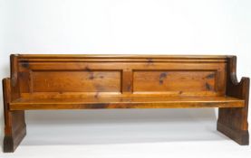 A Victorian pine pew, with double panelled back,