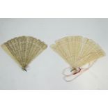 A late 19th century Chinese ivory brise fan and another pierced brise fan