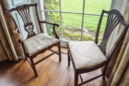 A 19th century mahogany elbow chair with drop in seat,