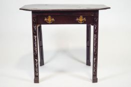 A mahogany side table, the rectangular top with cantered corners above one frieze drawer,
