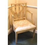 An early 19th century painted elbow chair with drop in seat on square tapering legs