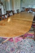 A 19th century mahogany triple pedestal dining table with two loose leaves,