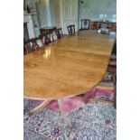 A 19th century mahogany triple pedestal dining table with two loose leaves,