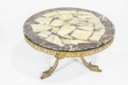 A 20th century composite marble topped coffee table, of round form,