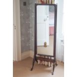 A mahogany cheval mirror on cabriole legs,