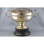 A silver plated two handled rose bowl on a plinth, of Art Nouveau form with a spot hammered finish,