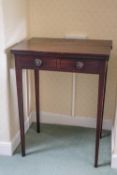 A 19th century mahogany table with two drop leaves, on square tapering legs,