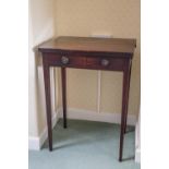 A 19th century mahogany table with two drop leaves, on square tapering legs,