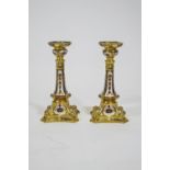 A pair of Royal Crown Derby solid gold band Imari candlesticks,