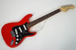 A (reputed) original signed by the Canadian Rock Group RUSH, electrical guitar, marked 'Helmsman',