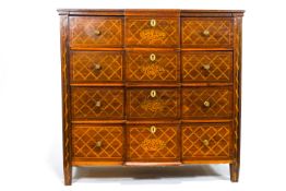 An early 19th century French mahogany and exotic wood inlaid breakfront chest of four drawers,