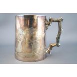 A silver mug, of tapered round form,