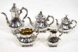 A silver five piece Rococo decorated lobed melon form tea and coffee service,