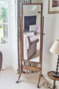A 19th century mahogany cheval mirror on splayed legs,