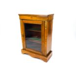 A Victorian walnut pier cabinet with inlaid detail and gilt metal mounts,