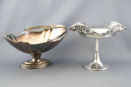 A silver plated swing handled cake basket with fancy applied edge,